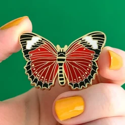 Wings Laced In Red Enamel Pin^Erstwilder Best